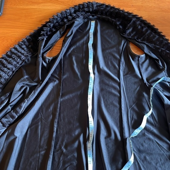 Small/medium but fits larger. Fabulous zipper detail  and fringe. - Picture 8 of 9